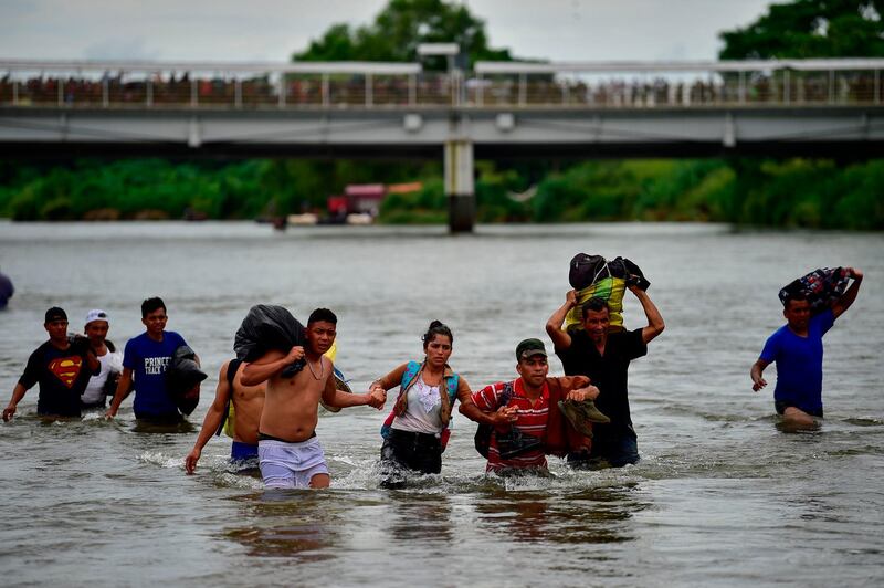 Groups try and make their way across the water.  AFP