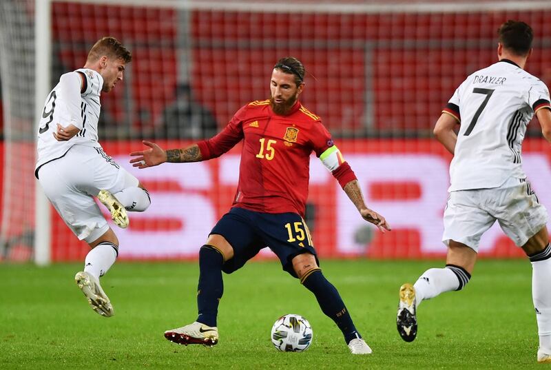 Timo Werner and Sergio Ramos compete for the ball. EPA