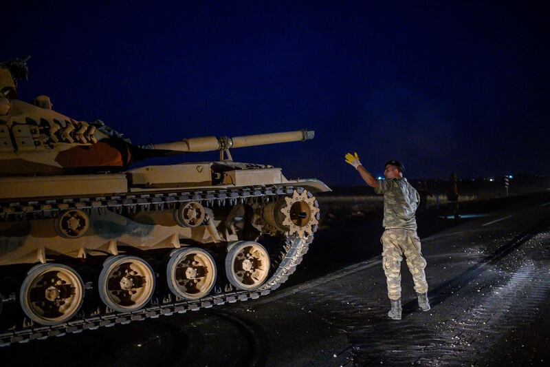 A Turkish army tank drives towards the border with Syria near Akcakale in Sanliurfa province.  AFP