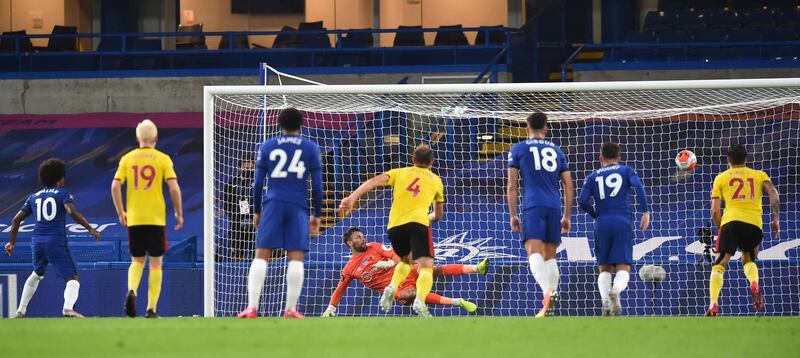 Willian of Chelsea (L) scores Chelsea's second from the penalty spot. EPA
