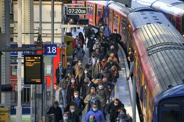 Commuters arrive at London Waterloo railway station in London. Getty Images