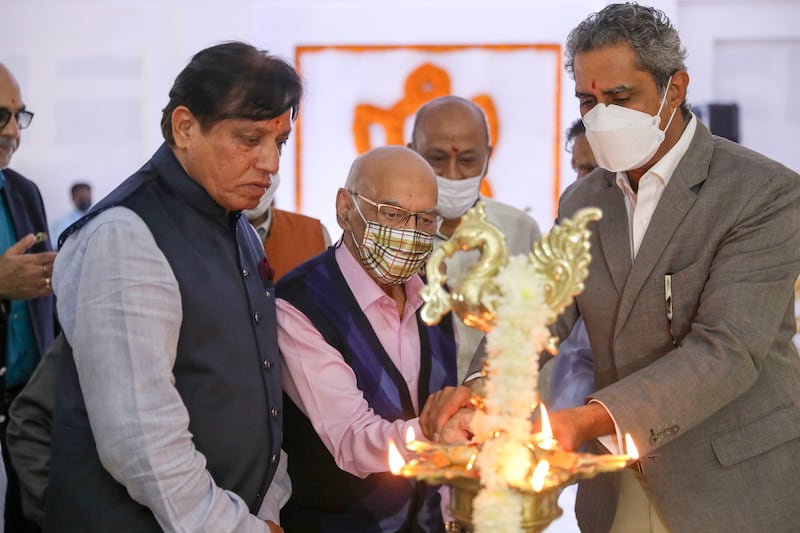 Trustees and guests light a candle at the beginning of a prayer ceremony for the topping of the Hindu temple at Jebel Ali in Dubai. All photos: Khushnum Bhandari / The National