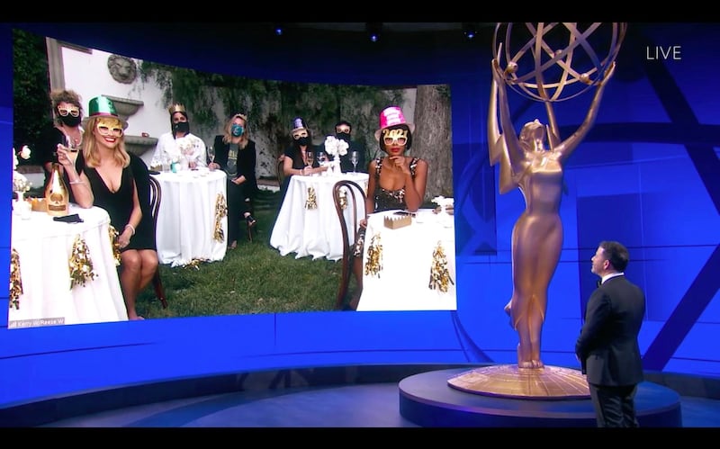 This handout screen shot released courtesy of American Broadcasting Companies, Inc. / ABC shows host Jimmy Kimmel in front of a screen showing nominee Kerry Washington (R) and Reese Witherspoon celebrating an early 2021 while watching remotely the 72nd Primetime Emmy Awards ceremony held virtually on September 20, 2020. Hollywood's first major Covid-era award show will look radically different to previous editions, with no red carpet and a host broadcasting from an empty theater in Los Angeles, which remains under strict lockdown. - RESTRICTED TO EDITORIAL USE - MANDATORY CREDIT "AFP PHOTO / American Broadcasting Companies, Inc. / ABC" - NO MARKETING NO ADVERTISING CAMPAIGNS - DISTRIBUTED AS A SERVICE TO CLIENTS --- NO ARCHIVE ---

 / AFP / American Broadcasting Companies, Inc. / ABC / RESTRICTED TO EDITORIAL USE - MANDATORY CREDIT "AFP PHOTO / American Broadcasting Companies, Inc. / ABC" - NO MARKETING NO ADVERTISING CAMPAIGNS - DISTRIBUTED AS A SERVICE TO CLIENTS --- NO ARCHIVE ---


