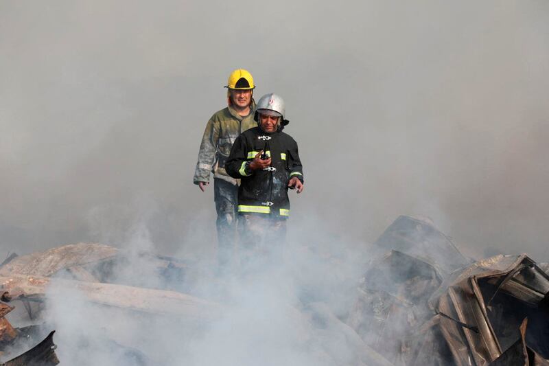 Emergency workers at the scene of a warehouse explosion near Tashkent airport in Uzbekistan. Reuters
