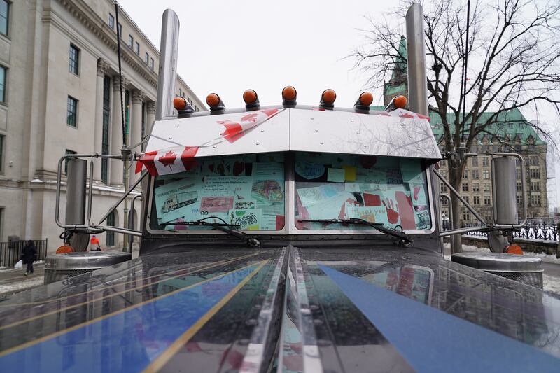 Signs fill the windshield of a parked lorry in central Ottawa. Willy Lowry / The National