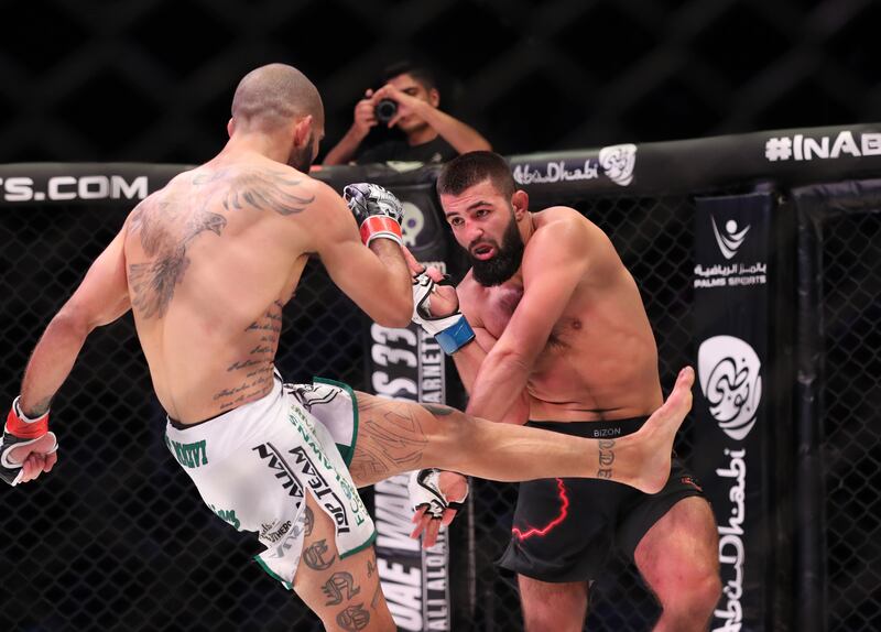 Josh Togo kicks Tahir Abdullaev during their welterweight title clash at UAE Warriors 33. 