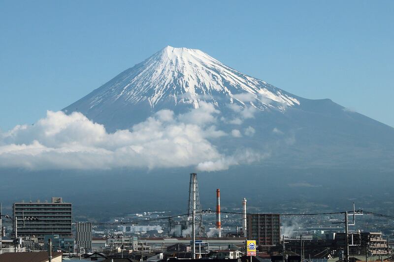 A snow-capped Mount Fuji in Shizuoka prefecture, Japan. Fuji city tourism officials confirmed that a metal fence will be installed in July to block tourists' access to a famous photo spot near the mountain. EPA
