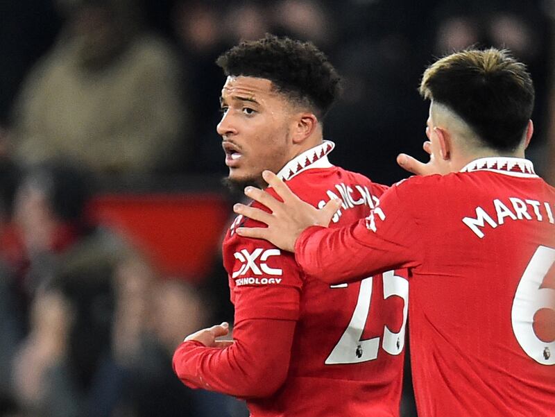 Manchester United's Jadon Sancho celebrates scoring their second goal with Lisandro Martinez in the 2-2 Premier League draw with Leeds United at Old Trafford on February 9, 2023. Reuters