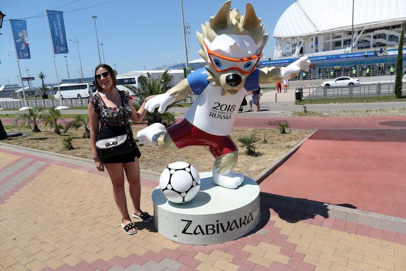 A Russian woman poses next to a Fifa World Cup 2018 mascot close to Sochi stadium in Sochi, Russia. EPA