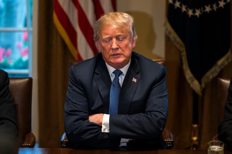 epa06658033 US President Donald J. Trump speaks with the media before a meeting with his military leadership in the Cabinet Room of the White House in Washington DC, USA, 09 April 2018. Trump said he will decide in the next few days whether the US will respond militarily for the reported chemical weapons attack in Syria. Trump also spoke about the FBI raid of his personal attorney Michael Cohen's office.  EPA/JIM LO SCALZO