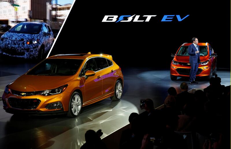 FILE PHOTO: Mark Reuss, President of General Motors North America, introduces the 2016 Chevrolet Bolt EV electric vehicle (R) and the Cruze hatchback at the North American International Auto Show in Detroit, Michigan, Janurary 11. 2016.  REUTERS/Gary Cameron/File Photo