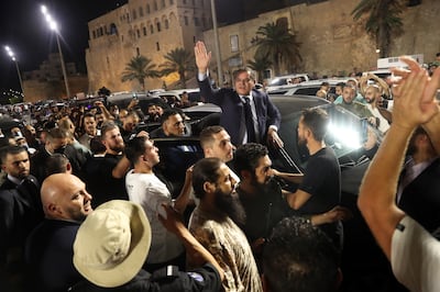 Abdulhamid Dbeibah addresses a crowd of supporters in Tripoli after lower house members passed a no-confidence vote in the unity government. EPA