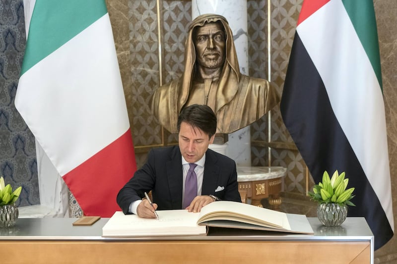 ABU DHABI, UNITED ARAB EMIRATES -November 15, 2018: HE Giuseppe Conte, Prime Minister of Italy (C), signs a guest book during a reception at the Presidential Palace.

( Rashed Al Mansoori / Ministry of Presidential Affairs )
---