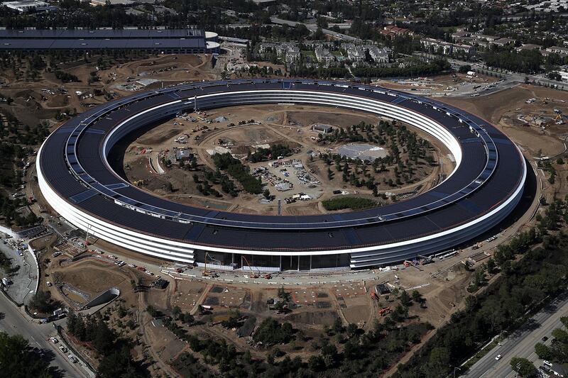 CUPERTINO, CA - APRIL 28:  An aerial view of the new Apple headquarters on April 28, 2017 in Cupertino, California. Apple's new 175-acre 'spaceship' campus dubbed "Apple Park" is nearing completion and is set to begin moving in Apple employees. The new headquarters, designed by Lord Norman Foster and costing roughly $5 billion, will house 13,000 employees in over 2.8 million square feet of office space and will have nearly 80 acres of parking to accommodate 11,000 cars.  (Photo by Justin Sullivan/Getty Images) *** Local Caption ***  bz04ma-markets-apple.jpg