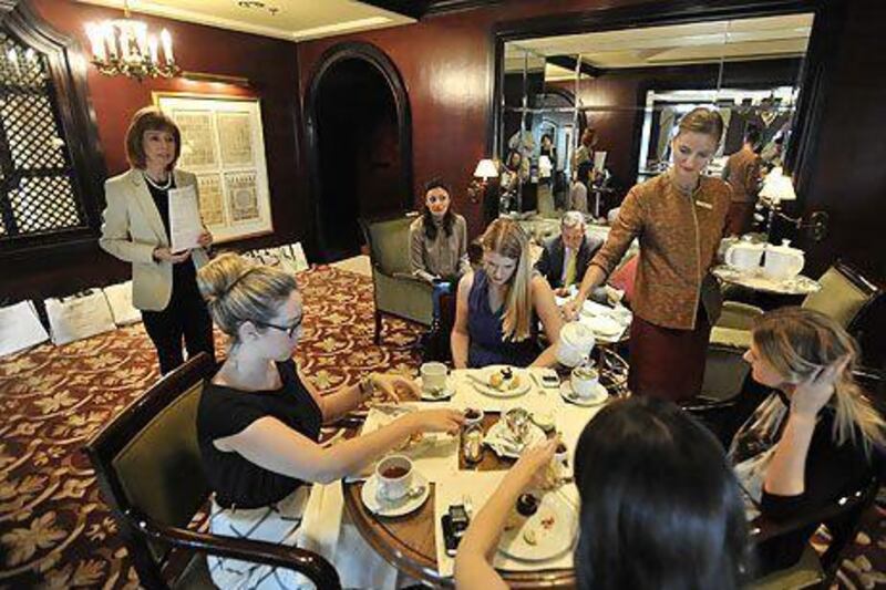 Alexandra Messervy of The English Manner, left, speaking at a session on etiquette and protocol at the Ritz-Carlton Hotel at the Marina in Dubai. Charles Crowell for The National