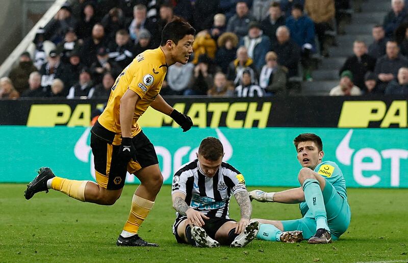 Hwang Hee-chan celebrates scoring for Wolves after a slip by Newcastle defender Kieran Trippier. Reuters