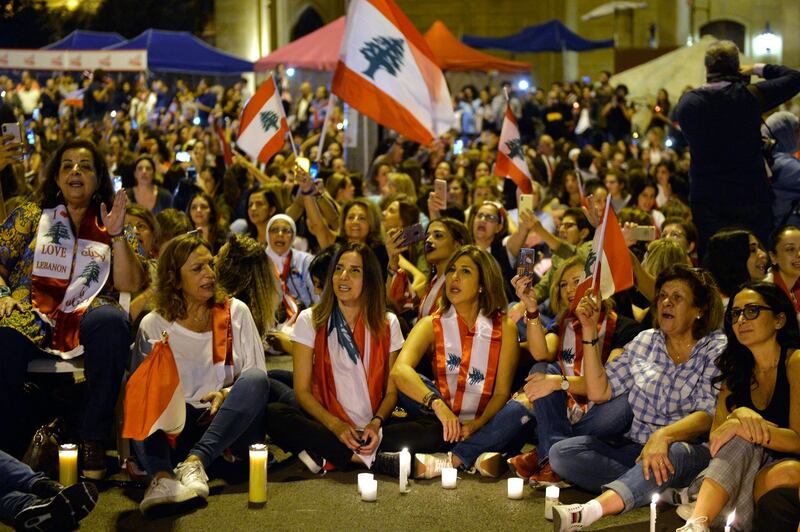 Lebanese women lit candles in support of the anti-government protests at the Martyrs' square in Beirut, Lebanon.  EPA