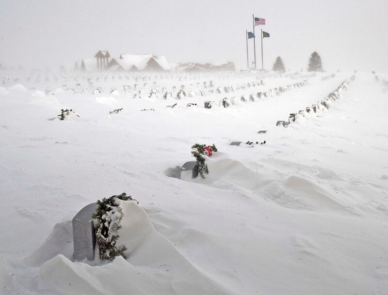 Headstones in North Dakota Veterans Cemetery, in Mandan, North Dakota, are blanketed by drifting snow. AP