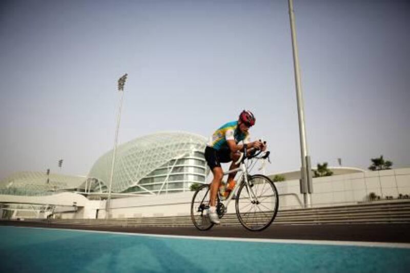 United Arab Emirates - Dubai - June 22nd, 2010:  Cyclists ride around the Yas Marina Circuit during an event organized by a group called Cycle Safe.  (Galen Clarke/The National)
