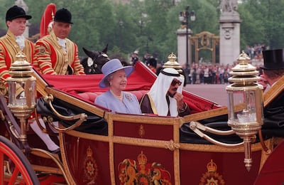 Queen Elizabeth II arrives at Buckingham Palace with then Emir Of Kuwait, Sheikh Jaber Al Ahmad Al Sabah, during his state visit to Britain, in 1995. Photo: Tim Graham Photo Library via Getty Images