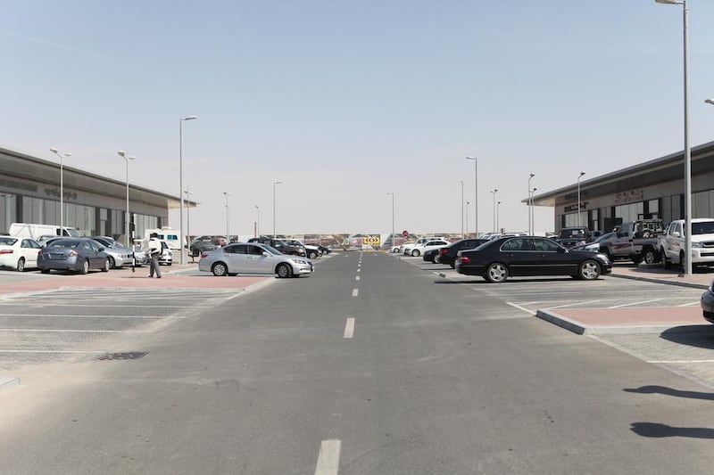 Car dealers at Abu Dhabi Motor World say sales have plunged to almost zero since they were forced to move to the new site on the outskirts of the city. Fatima Al Marzooqi / The National