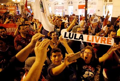 FILE PHOTO: Supporters of the former Brazilian President Luiz Inacio Lula da Silva attend a rally in Curitiba, Brazil August 30, 2018. The sign reads "Free Lula." REUTERS/Rodolfo Buhrer/File photo