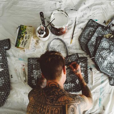 Artist Oliver Coreaux uses luxury handbags as a canvas for his paintings. Courtesy Oliver Coreaux