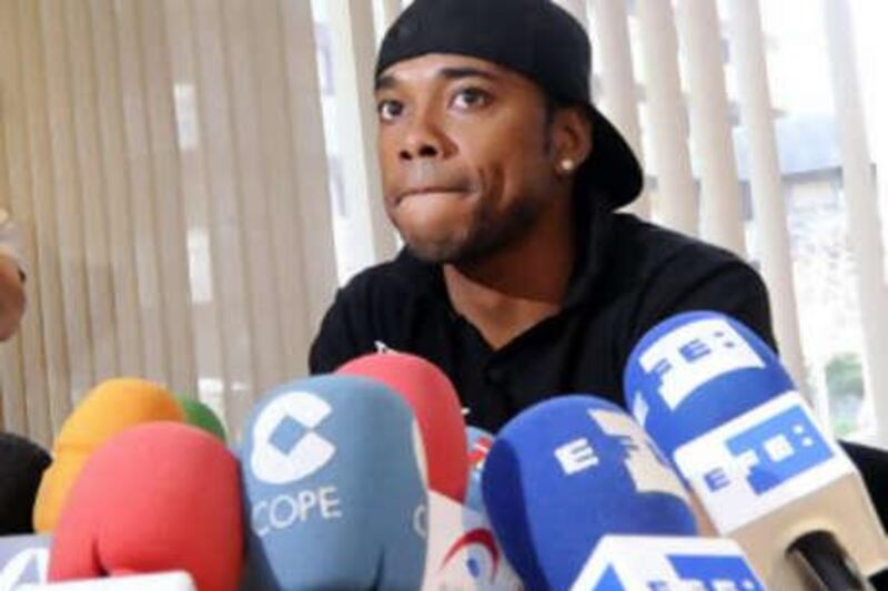 Real Madrid's Brazilian player Robinho attends a press conference on August 31, 2008 in Madrid. Robinho said that his "head was at Chelsea" and that he was determined to leave the Spanish club despite efforts of team bosses to keep him. I've already told the president (Ramon Calderon), and coach (Bernd Schuster), management and (the media): my head is there (at Chelsea), I want to play over there," the 24-year-old said. AFP PHOTO/ Dani POZO *** Local Caption ***  203278-01-08.jpg