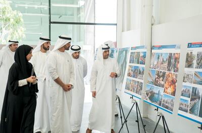 ABU DHABI, UNITED ARAB EMIRATES - February 22, 2018: HH Sheikh Mohamed bin Zayed Al Nahyan, Crown Prince of Abu Dhabi and Deputy Supreme Commander of the UAE Armed Forces (3rd L), looks at development plans for Mina Zayed Port with HE Maryam Eid Al Mheiri, CEO of Media Zone Authority and CEO of twofour54 (L). Seen with HE Mohamed Mubarak Al Mazrouei, Undersecretary of the Crown Prince Court of Abu Dhabi (2nd L), HE Falah Mohamed Al Ahbabi, Chairman of the Department of Urban Planning and Municipalities, and Abu Dhabi Executive Council Member (2nd R) and HE Jassem Mohamed Bu Ataba Al Zaabi, Chairman of Abu Dhabi Executive Office and Abu Dhabi Executive Council Member (R).

( Rashed Al Mansoori / Crown Prince Court - Abu Dhabi )
---