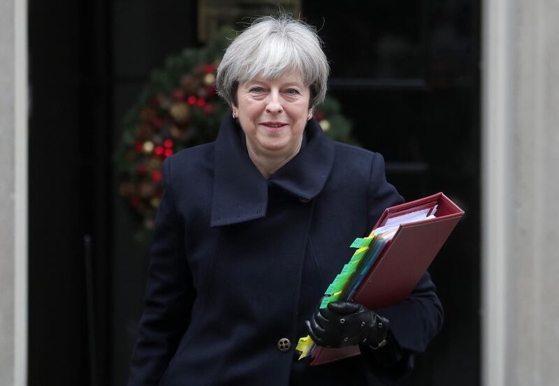 Britain's Prime Minister Theresa May leaves 10 Downing Street in central London on December 6, 2017, ahead of the weekly Prime Minister's Questions (PMQs) session in the House of Commons.
Northern Ireland's Democratic Unionist Party accused Britain on Tuesday of keeping it in the dark over a proposed Brexit deal on the Irish border but said it would examine the text after blocking an agreement in Brussels. / AFP PHOTO / Daniel LEAL-OLIVAS