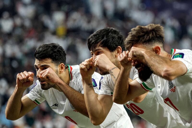 Iran's Mehdi Taremi, left, and teammates celebrate after he scored their second goal in their 1-2 Asian Cup Group C game against the UAE at Education City Stadium in Al Rayyan, near Doha, on January 23, 2024. AFP