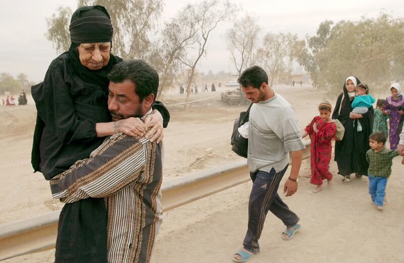 Iraqis fleeing during the fighting between US and Iraqi forces in 2003. AFP