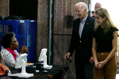 US President Joe Biden arrives to vote early in the midterm elections with his granddaughter Natalie Biden in Wilmington, Delaware on October 29. Natalie Biden is a first-time voter and daughter of the late Beau Biden. POOL /  AFP