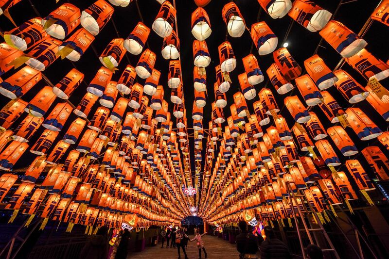 Visitors walk through a tunnel decorated with lanterns at a light show to celebrate the upcoming Chinese Lunar New Year, in Xian, Shaanxi, China. REUTERS