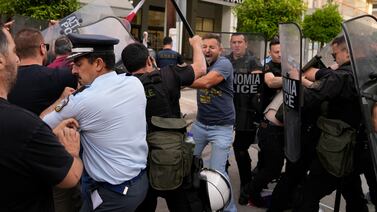 Police clash with protesters outside a court house in Kalamata, southwestern Greece, on Tuesday. AP