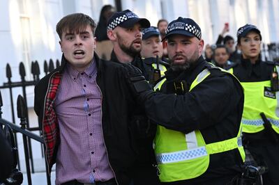 Police detain a man close to a major pro-Palestinian  demonstration in London on Saturday, the UK's Armistice Day. British Prime Minister Rishi Sunak had described the march as 'provocative and disrespectful' and far-right counter-protesters scuffled with police. AFP 