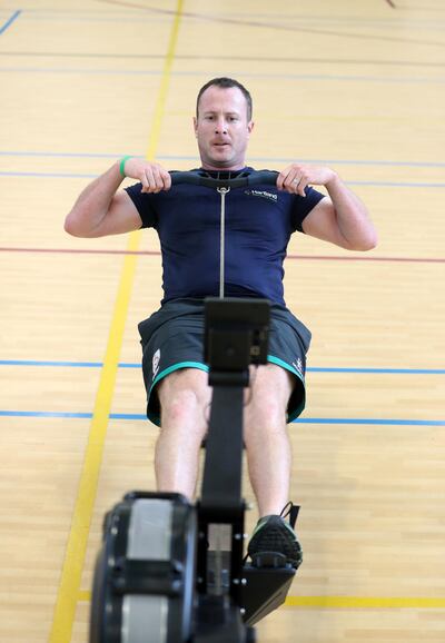 Dubai, United Arab Emirates - November 21, 2018: Niall Statham, head of Physical education on the rowing machine as Hartland International School does a 24hr rowing challenge . Wednesday the 21st of November 2018 at Hartland International School, Dubai. Chris Whiteoak / The National