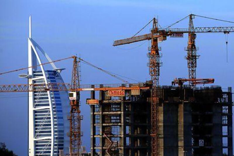 A construction site near the Burj Al Arab in Dubai. Confidence has returned to the city's property sector with a number of new projects announced during the year. Satish Kumar / The National