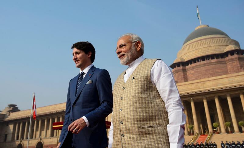 Mr Trudeau and Mr Modi are seen side by side outside the Presidential Palace. Sean Kilpatrick / The Canadian Press via AP