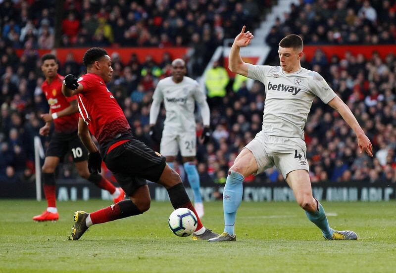 Soccer Football - Premier League - Manchester United v West Ham United - Old Trafford, Manchester, Britain - April 13, 2019  West Ham's Declan Rice in action with Manchester United's Anthony Martial                        REUTERS/Phil Noble  EDITORIAL USE ONLY. No use with unauthorized audio, video, data, fixture lists, club/league logos or "live" services. Online in-match use limited to 75 images, no video emulation. No use in betting, games or single club/league/player publications.  Please contact your account representative for further details.
