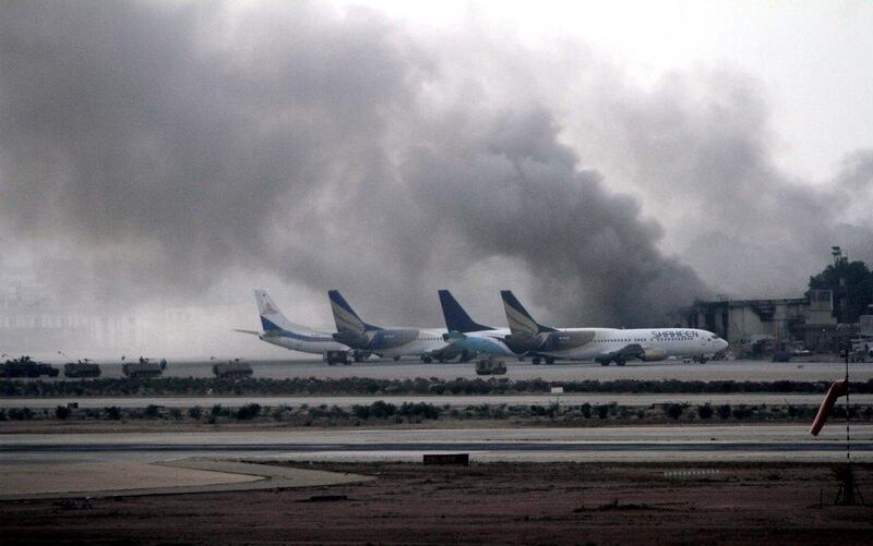 Smoke billows from inside the Jinnah International Airport, after suspected Islamic militants attacked the airport, in Karachi, Pakistan. At least 23 people, including 10 suspected terrorists, were killed when militants stormed the airport. EPA/REHAN KHAN 
