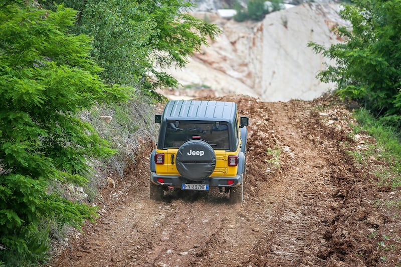 A Wrangler takes on a rocky incline.