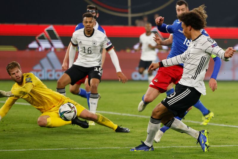 Leroy Sane shoots against Liechtenstein goalkeeper Benjamin Buechel. AFP