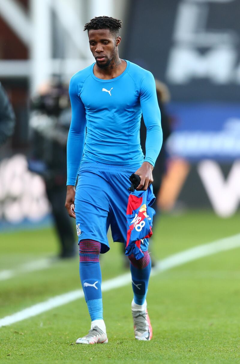 LONDON, ENGLAND - DECEMBER 19:  Wilfried Zaha of Crystal Palace looks dejected following his team's defeat in the Premier League match between Crystal Palace and Liverpool at Selhurst Park on December 19, 2020 in London, England. The match will be played without fans, behind closed doors as a Covid-19 precaution. (Photo by Clive Rose/Getty Images)