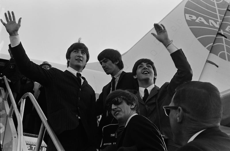 The Beatles wave at the crowd while in the US for their first US concerts, February 1964; clockwise, John Lennon (1940 - 1980), George Harrison (1943 - 2001), Paul McCartney, and Ringo Starr. (Photo by Daily Express/Hulton Archive/Getty Images)
