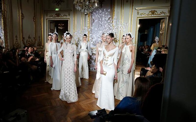 Models present creations by French designer Alexis Mabille as part of his Haute Couture Spring/Summer 2014 fashion collection in Paris January 20, 2014. REUTERS/Gonzalo Fuentes (FRANCE - Tags: FASHION)