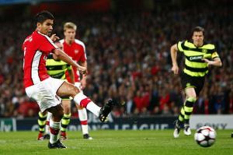 Eduardo shoots and scores his controversial penalty against Celtic on Wednesday night.