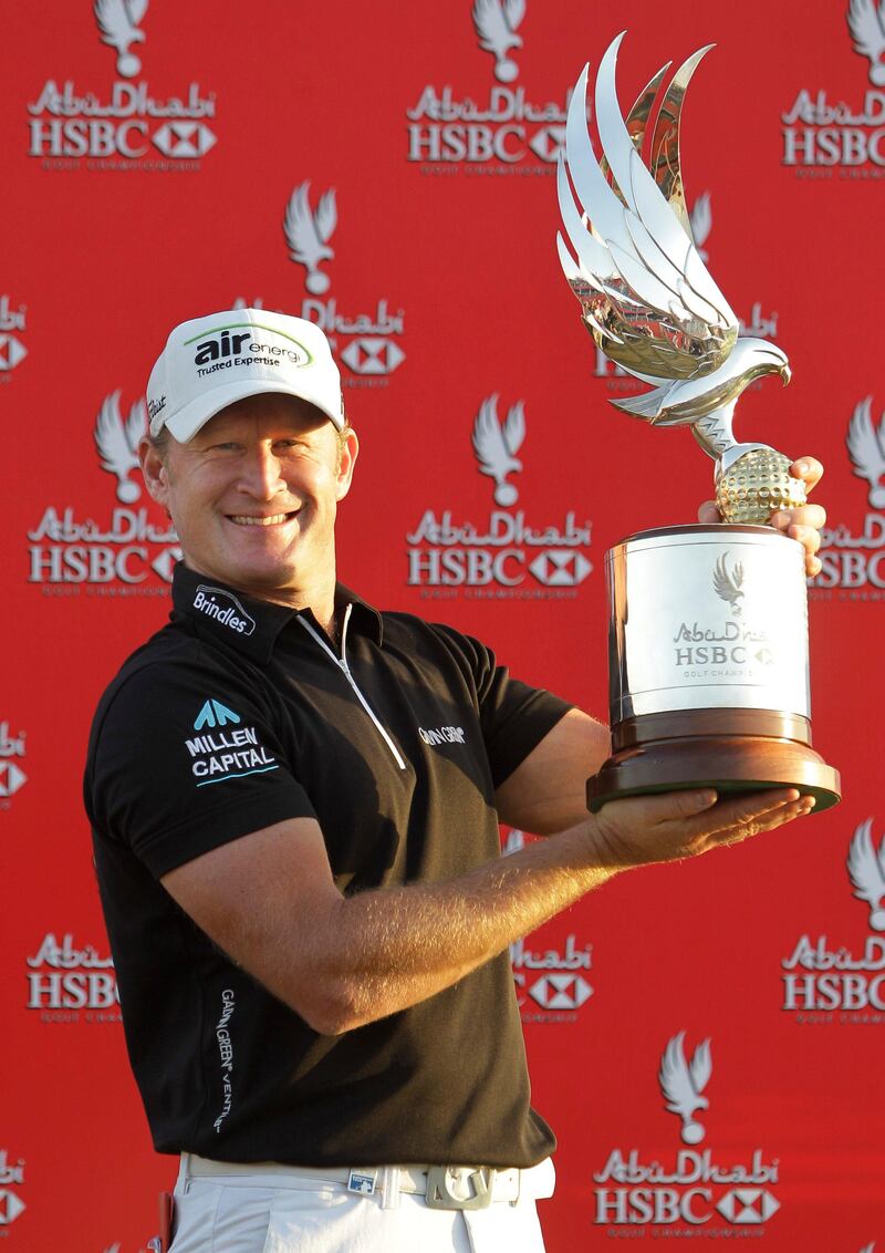 Jamie Donaldson from Wales holds the trophy after he wins the Abu Dhabi Golf Championship in United Arab Emirates, Sunday, Jan. 20, 2013. (AP Photo/Kamran Jebreili) *** Local Caption ***  Mideast Emirates Abu Dhabi Golf Championship.JPEG-03377.jpg