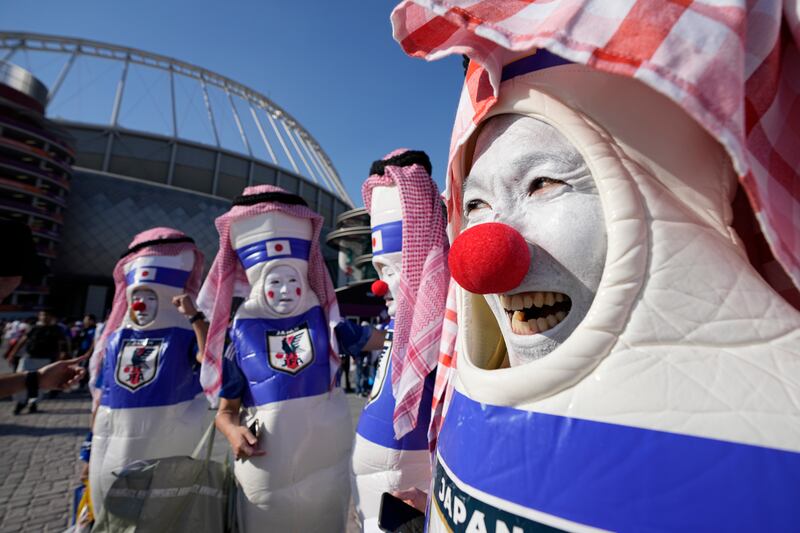 Japan supporters cheer before the World Cup group E match between against Germany. AP