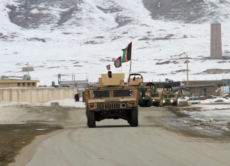 Afghan National Army forces go towards the site of an airplane crash in Deh Yak district of Ghazni province. Reuters